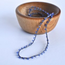 Indigo Sparkle crocheted necklace in tiny wooden bowl